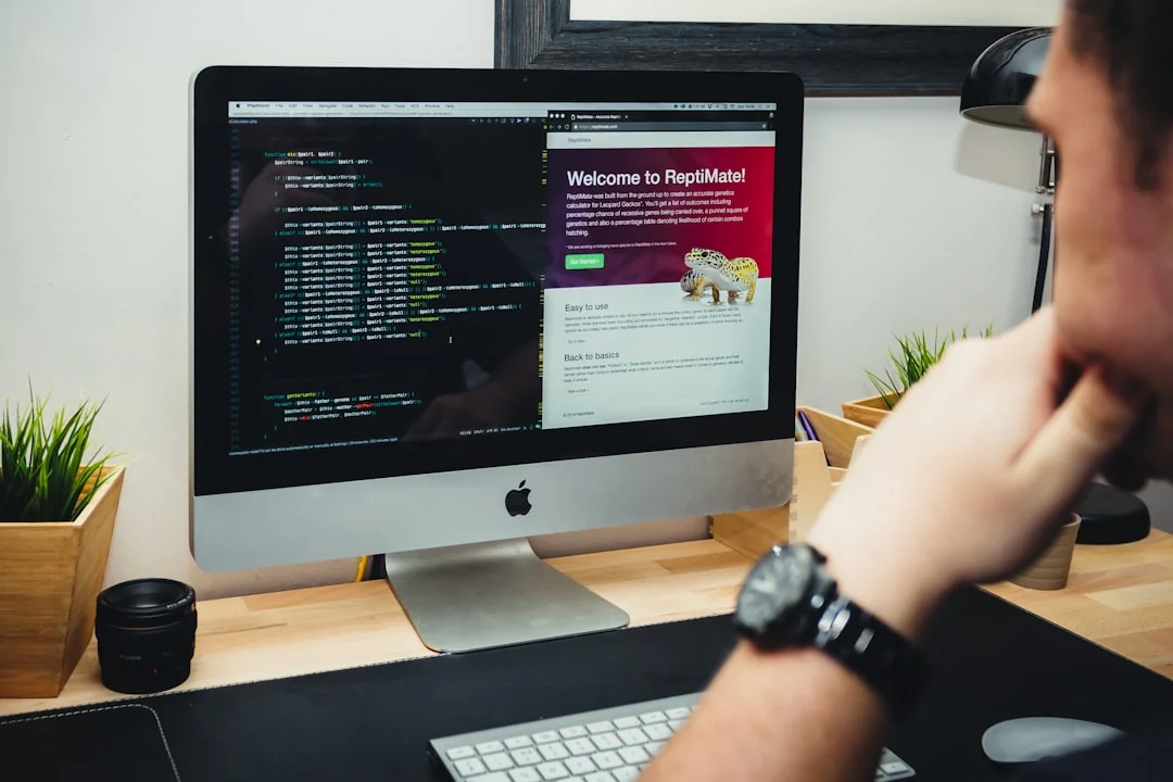 A modern workspace featuring dual computer monitors displaying web design projects, emphasizing technology and productivity.